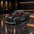 Dark charcoal classic muscle car LEGO model in a dark premium garage