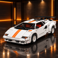 White Lamborghini Countach style LEGO Technic model with orange stripes in a dark premium garage