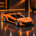Orange open-top NSX style LEGO model in a dark premium garage with orange ambient glow